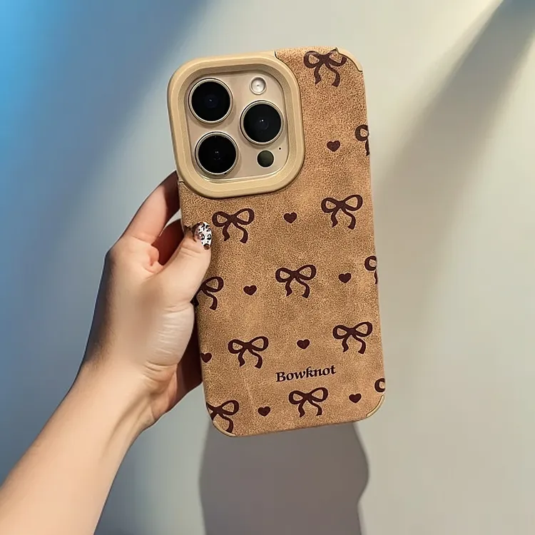 卖卖壳暖乎乎蝴蝶结适用苹果16手机壳iPhone15翻毛皮14/13/12软套