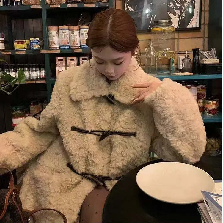 毛毛外套女新款秋冬女装大翻领牛角扣中长款黑色加厚皮毛一体大衣