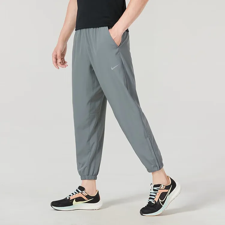 NIKE/耐克男士裤夏季季新款透气跑步运动裤束脚休闲九分梭织长裤
