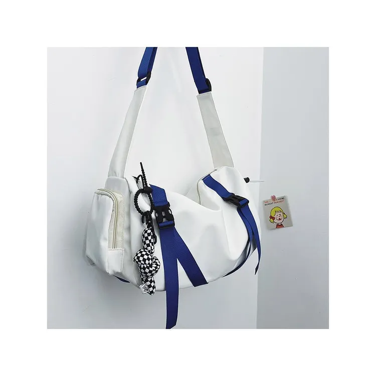 爆款男女帆布斜挎包日系原宿中大学生休闲背包时尚透气大容量挎包