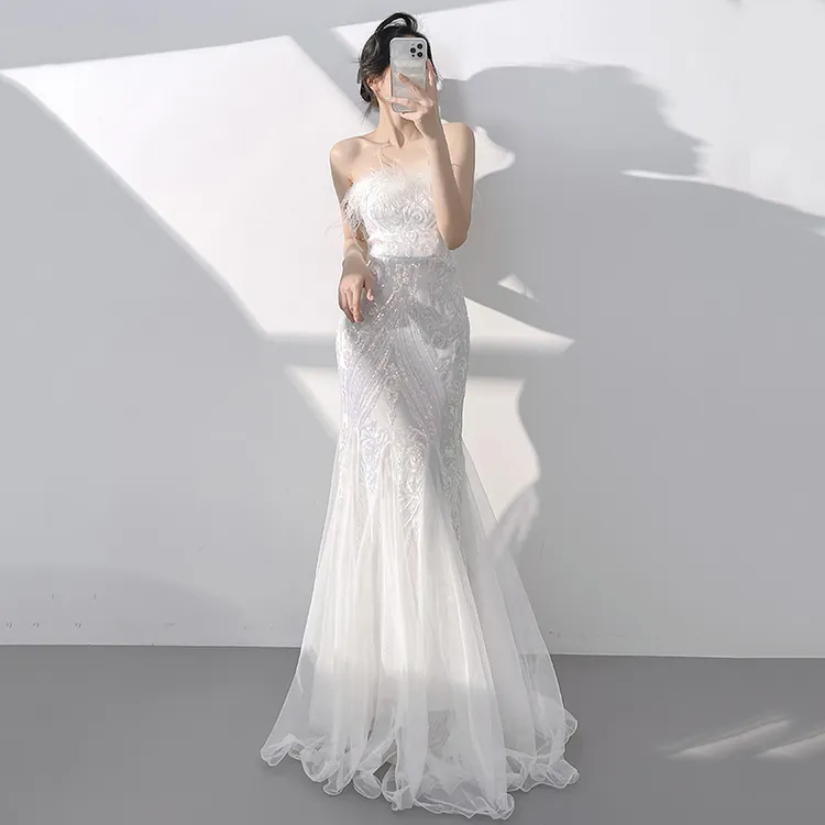 白色晚礼服女2025新款宴会气质轻奢小众抹胸主持鱼尾裙高端鸵鸟毛