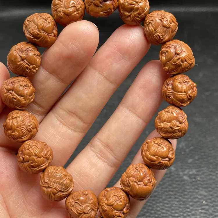 新款龙纹桃核1.4整身财神手串