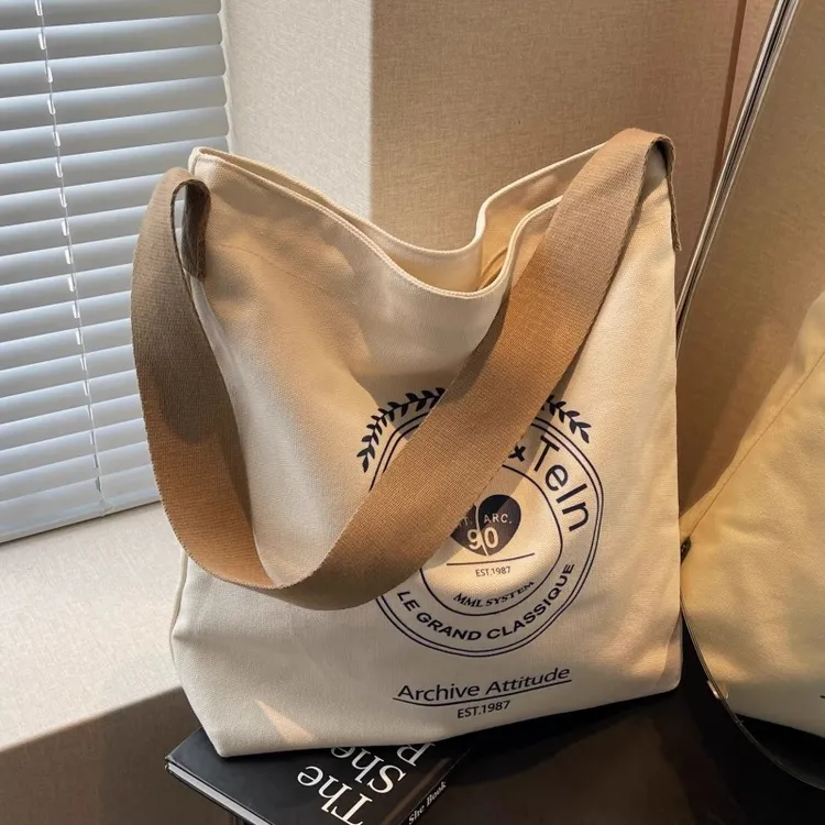 大容量包包女2025新款单肩通勤宽带帆布袋包百搭休闲腋下托特大包