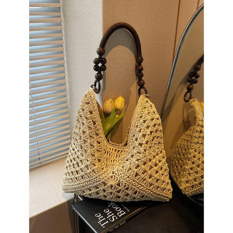 夏天爆款草编包包女2025新款海边沙滩镂空单肩包手提编织菜篮子包