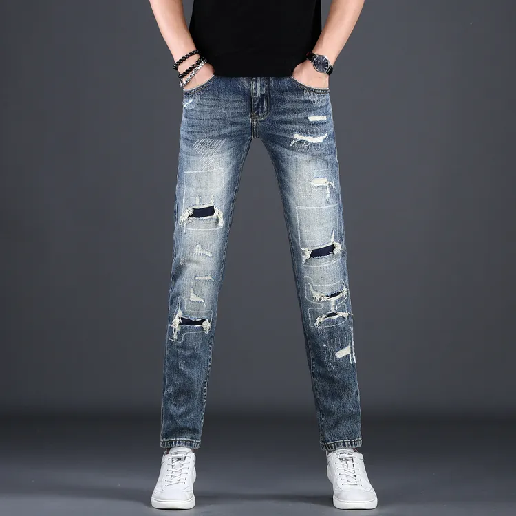 MR.25香港高端蓝色破洞补丁男士牛仔裤秋冬新款修身小脚牛仔长裤