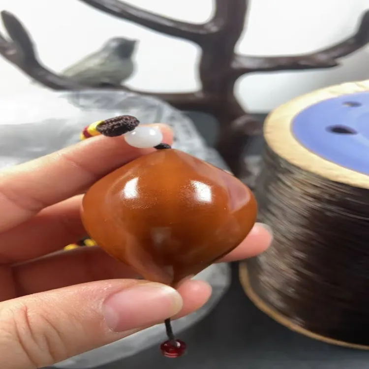 巴西橄榄核三生三世生命文玩手把件商品图