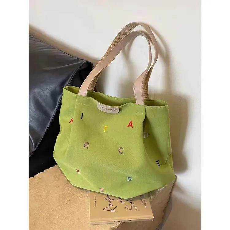 休闲大容量包包女夏季时尚百搭单肩刺绣字母帆布包学生上课托特包