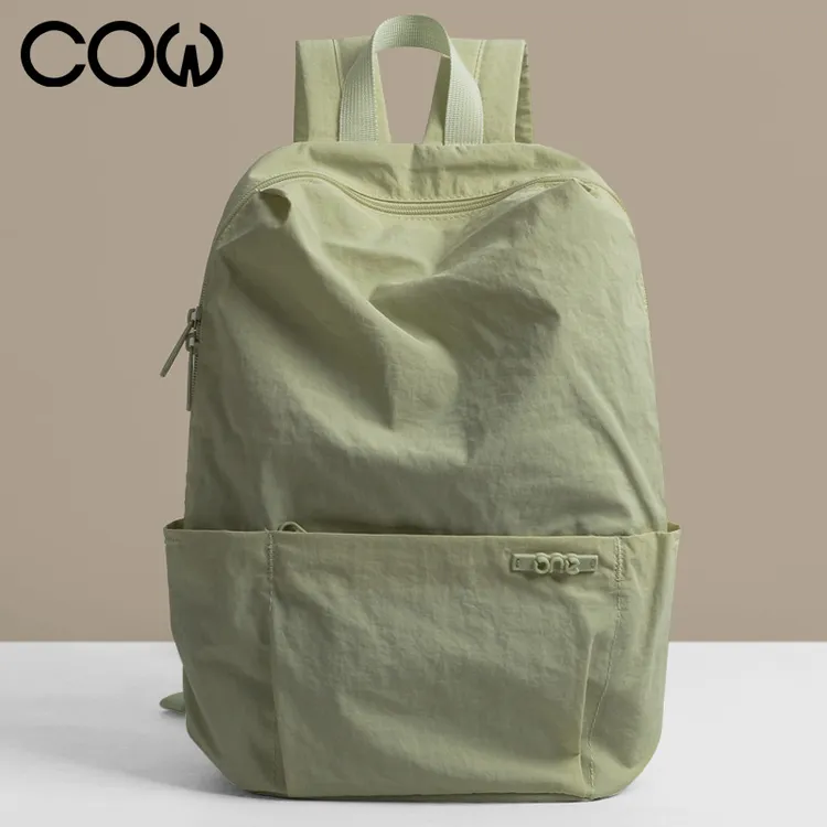 法国COW时尚女士双肩背百搭超轻休闲包大学生双肩包女落叶绿C-405