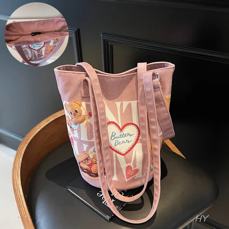 小众卡通帆布托特包包女夏季学生百搭腋下包大容量单肩通勤水桶包