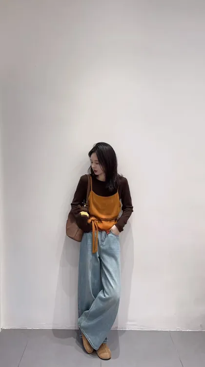 2025秋季新款韩系圆领长袖针织绑带背心假两件套橘色上衣牛仔裤