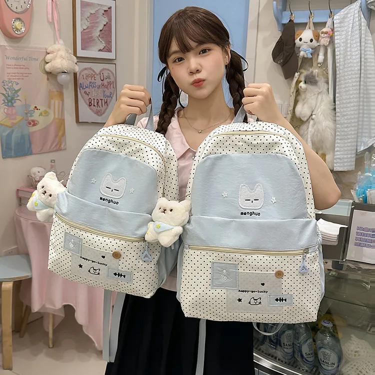 高颜值波点撞色学生书包女百搭学院风双肩包轻便出游女学生背包