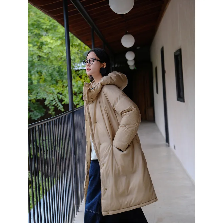 麻霖90白鹅绒空气感轻盈保暖丁达尔透光防水面料中长款连帽羽绒服