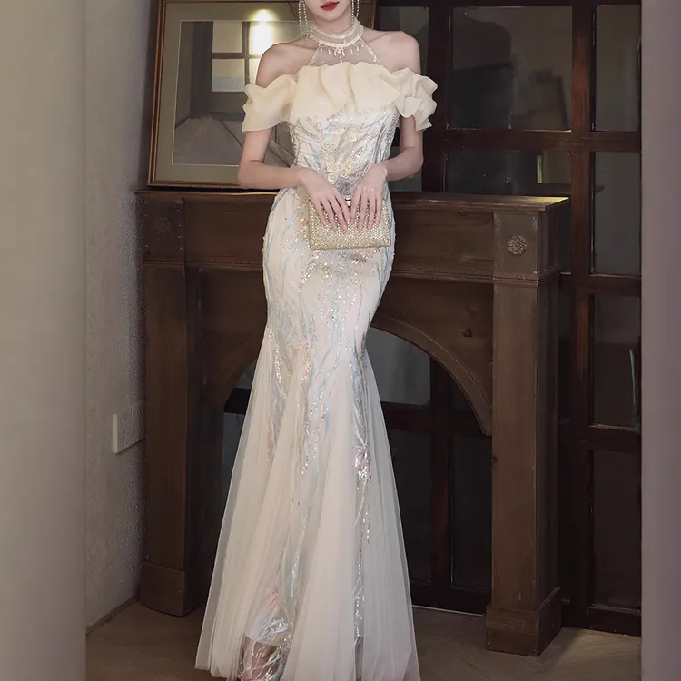 宴会晚礼服女2025新款挂脖晨袍年会主持人香槟色鱼尾订婚晚礼服裙