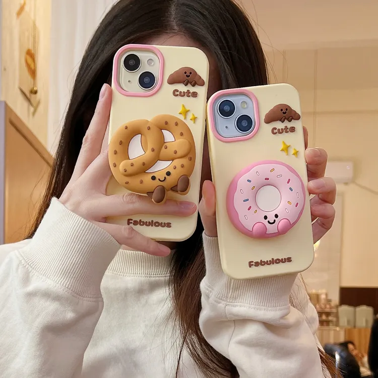 适用【苹果】创意支架甜甜圈iphone16防摔14卡通硅胶软壳15可爱女款