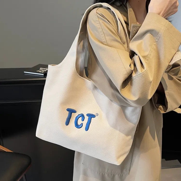 大容量包包女2025新款刺绣字母帆布手提袋小众百搭通勤腋下托特包