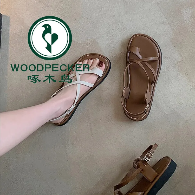 啄木鸟欧若风软皮凉鞋女2025夏新款平底百搭套趾交叉带沙滩罗马鞋