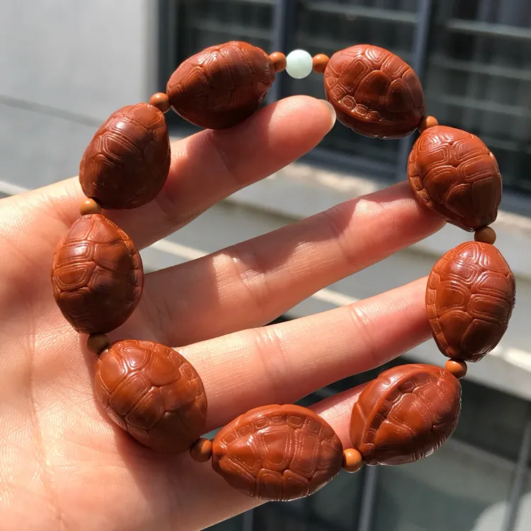 橄榄核雕随形富甲手串尺寸1.6*2.2cm文玩老油核富甲天下龟壳龟甲
