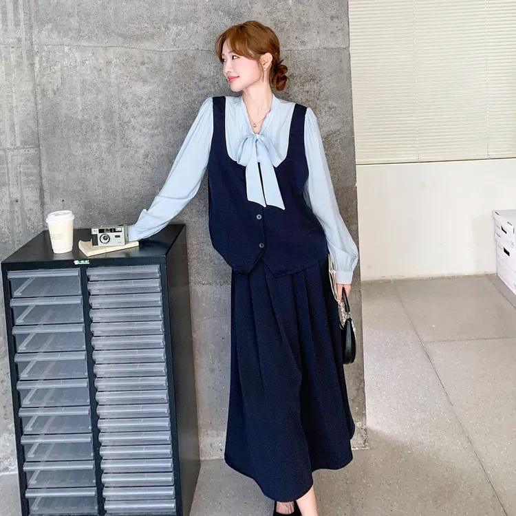 深蓝色轻熟风气质套装裙女秋2025新款假两件拼接上衣半身裙两件套