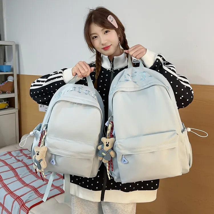 简约纯色刺绣字母双肩包女大容量学生上课书包男外出旅行小背包