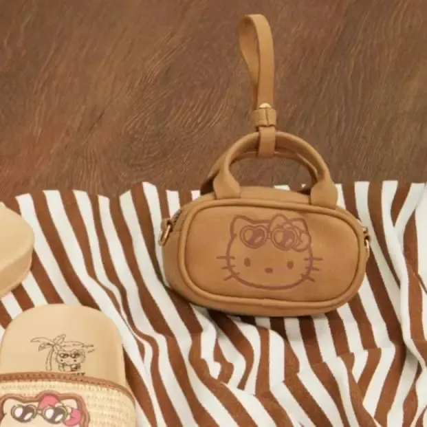 2025新款hello kitty夏日黑皮复古百搭可爱迷你耳机包手提斜挎包