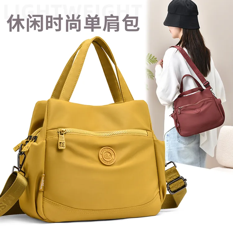 文艺风斜挎包大容量中年妈妈女包轻便简约防水休闲手提包单肩布包