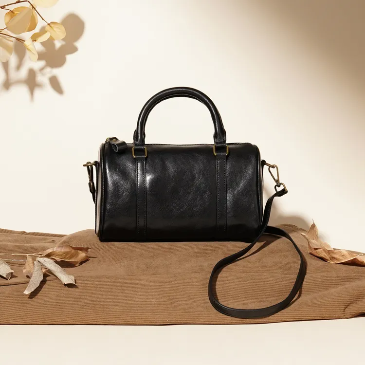 岩牛通勤风手提款单肩款树膏植鞣头层牛皮女士斜挎包圆筒复古1028