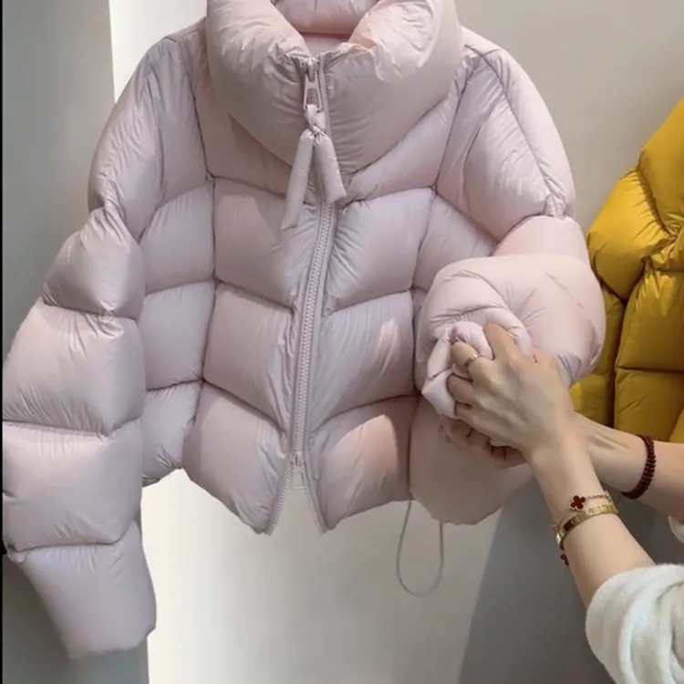 2025冬季韩系时尚设计感连帽粉色羽绒服女高级感鸭绒保暖面包服