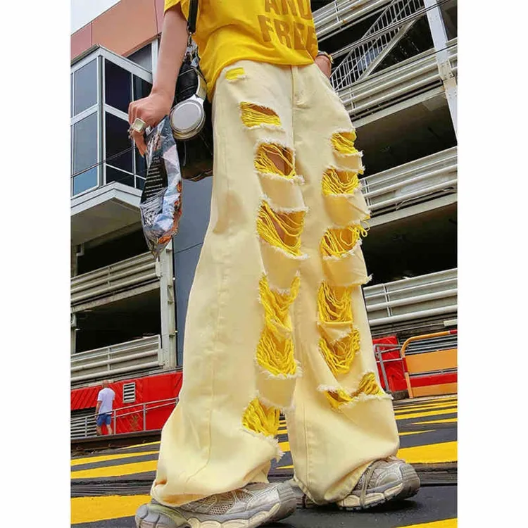 黄色破洞牛仔裤女2025秋冬新款设计感不规则小众辣妹宽松阔腿长裤