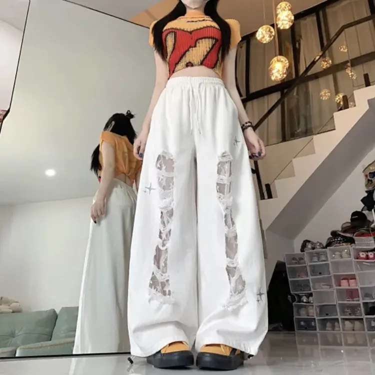 新款破洞拼接蕾丝弯刀牛仔跳舞长裤女夏季潮流款式［尺码拍小］