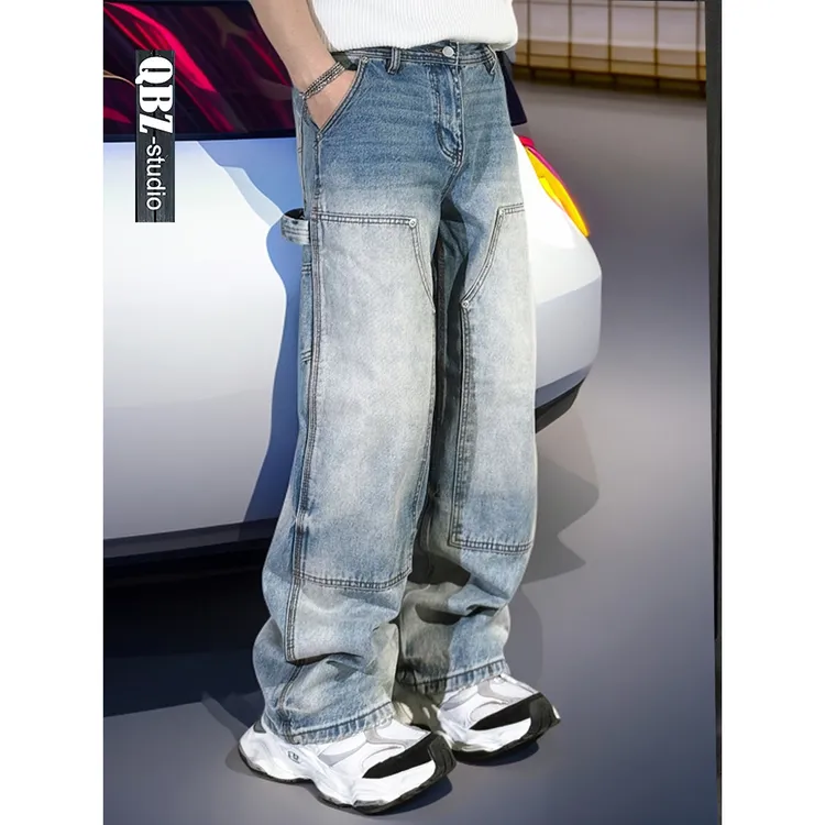 冈山水洗蓝巴黎潮牌宽松直筒伐木工装牛仔裤铆钉拼接磨白男款长裤