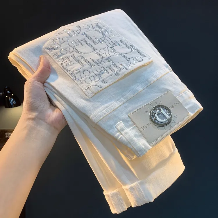 高端轻奢男士牛仔裤秋季新款白色休闲小脚长裤烫珠弹力修身男裤子