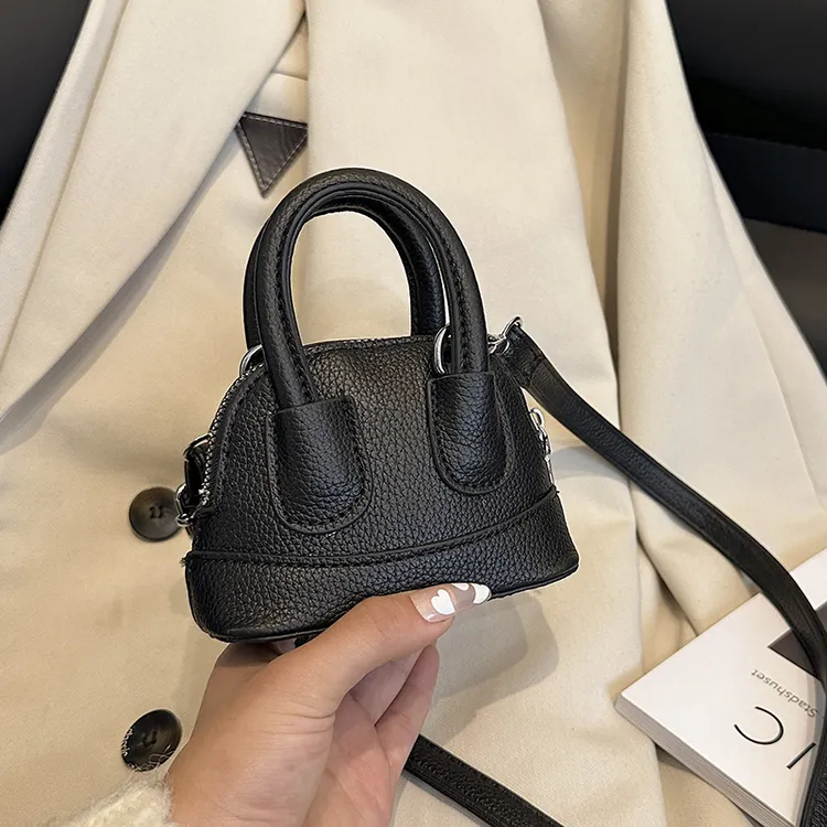 秋冬新款儿童包包可爱女童公主手提贝壳包网红洋气女孩配饰斜挎包