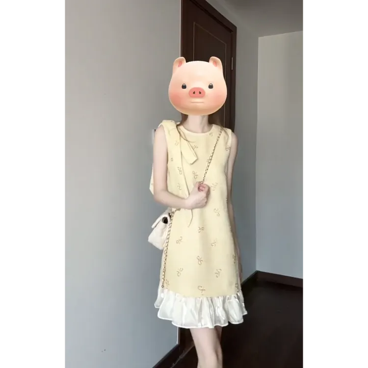 富家千金蝴蝶结碎花奶黄色无袖背心连衣裙女夏季新款小个子短裙
