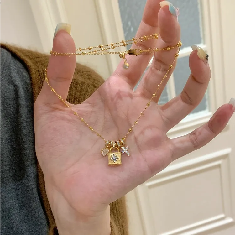铜合金项链 新中式十字架小锁包吊坠拉丝设计感项链轻奢锁骨链