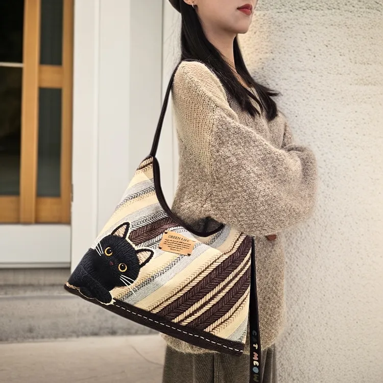 尼睿原创斜纹毛线黑煤球刺绣百搭休闲新月单肩斜跨包大容量通勤女