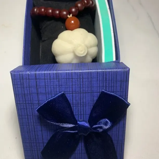 象牙果把件 胜蒜“券”在握