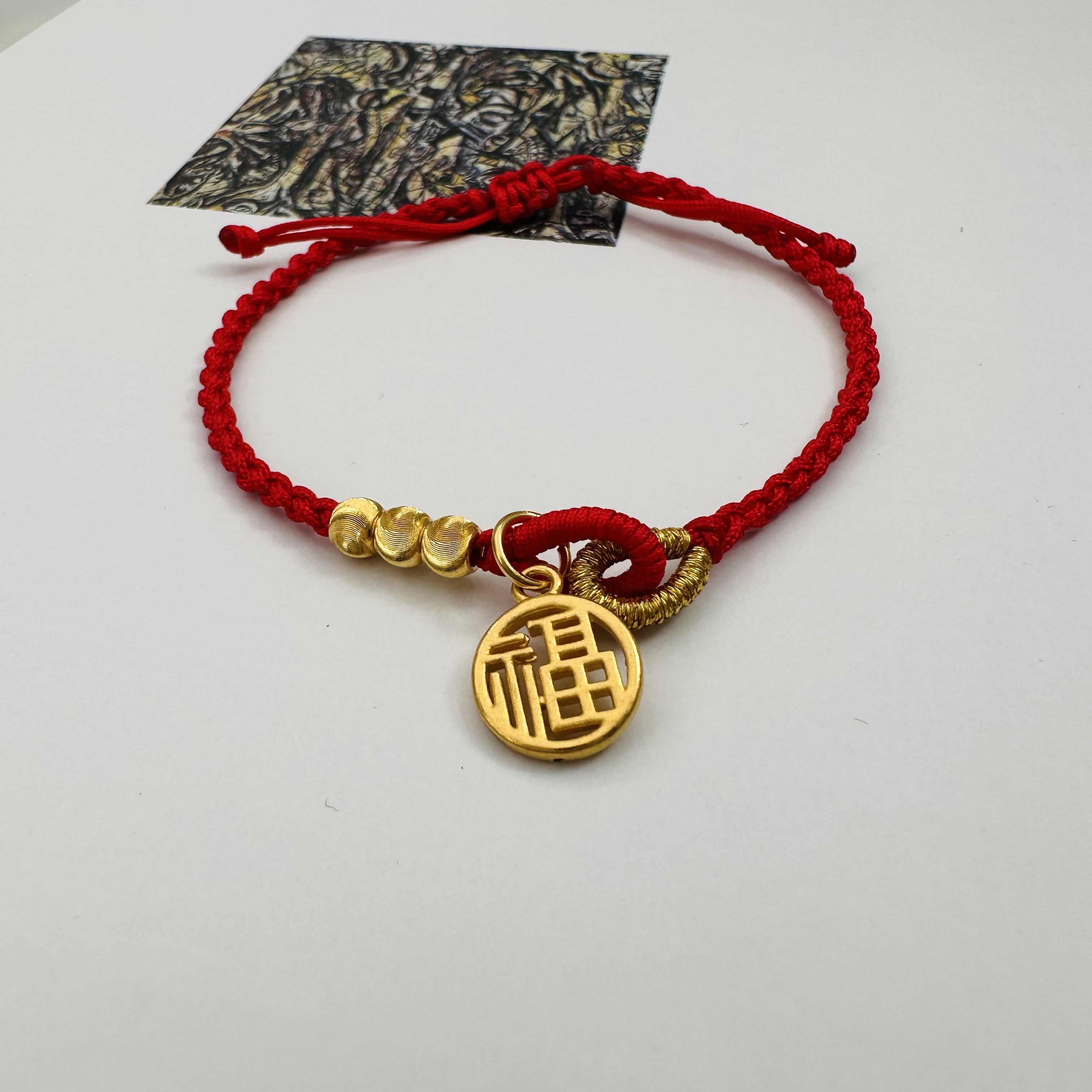 999足金镂空福牌古法手工编绳