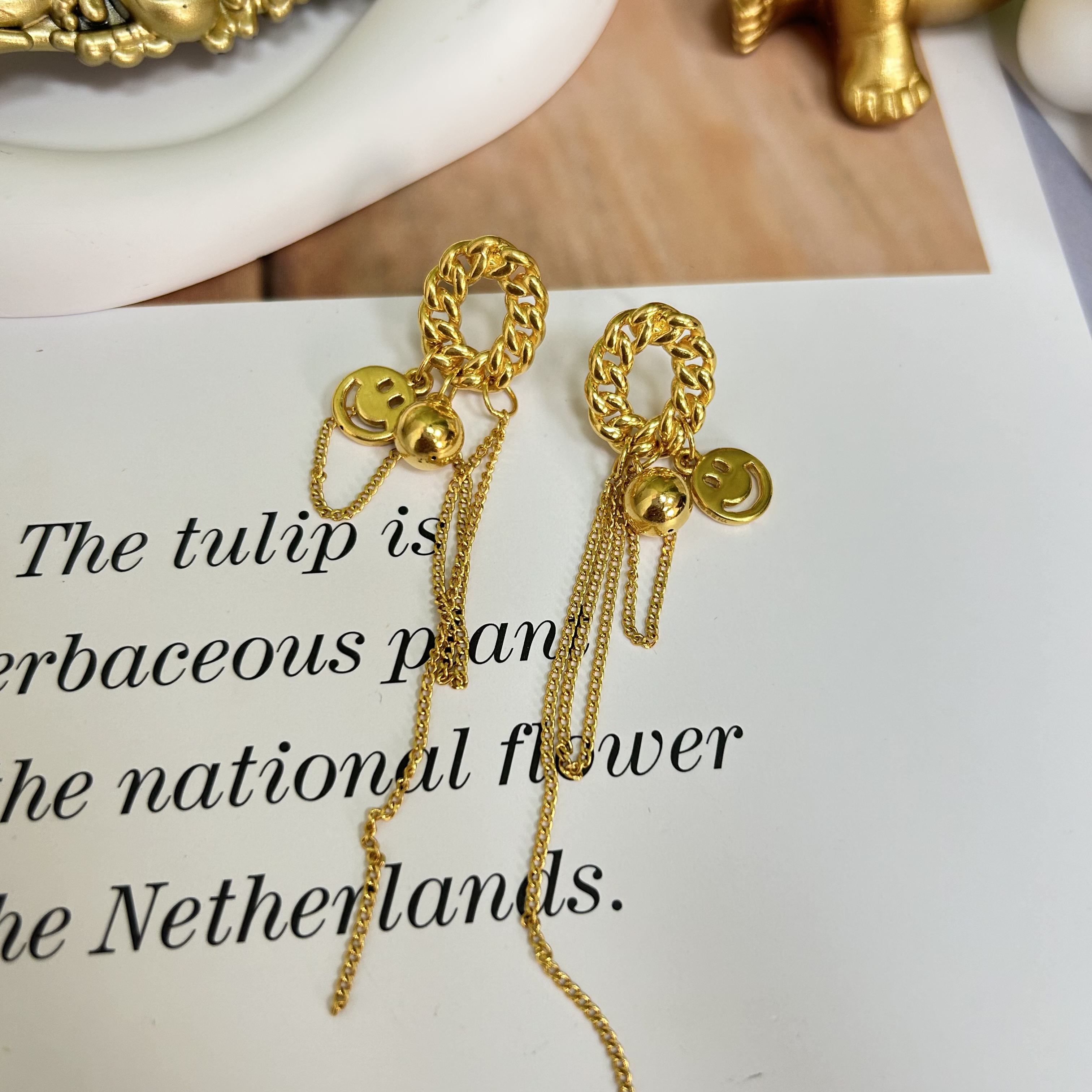 足金999黄金5D无氰时尚硬金笑脸流苏款耳针9.78