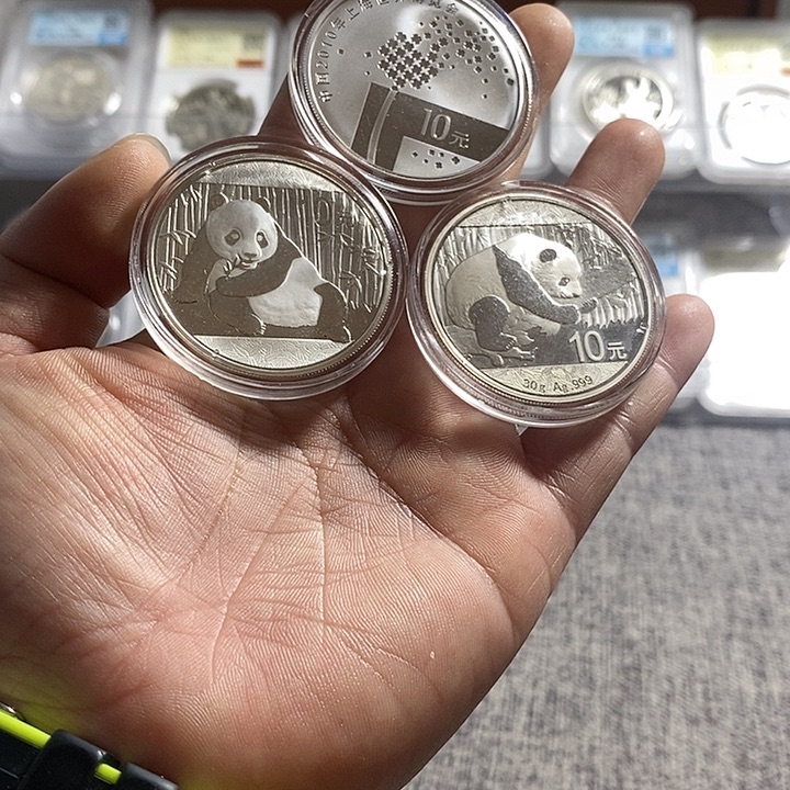 纯银瑕疵品无盒证特价15+16猫+09世博会各一枚如图