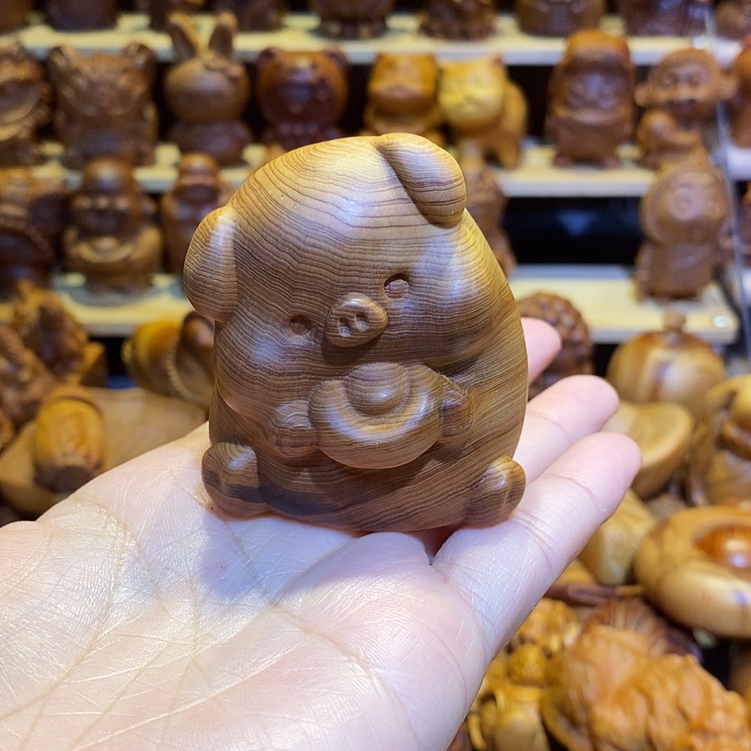 智***锦木崖柏木雕手把件