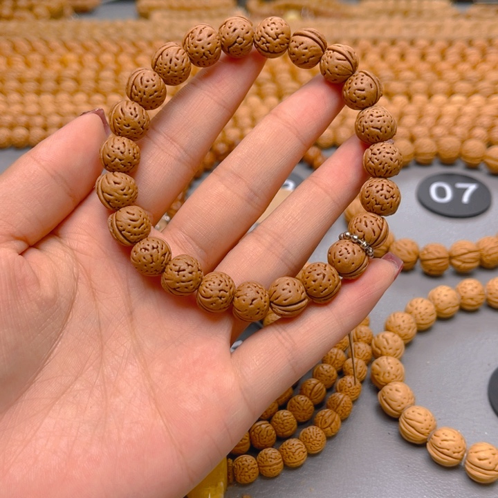 轮***户菩提籽类桃核手串