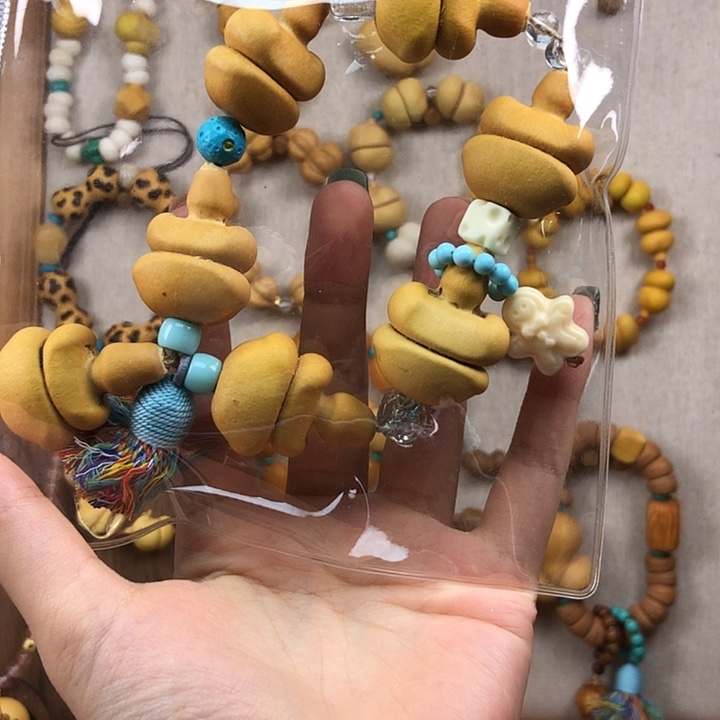 沙***子熊脸钱袋手持专拍链接