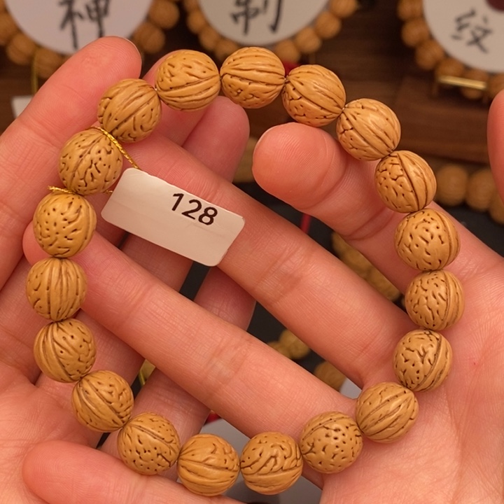 桃核手串凤羽12齐窄桩矮