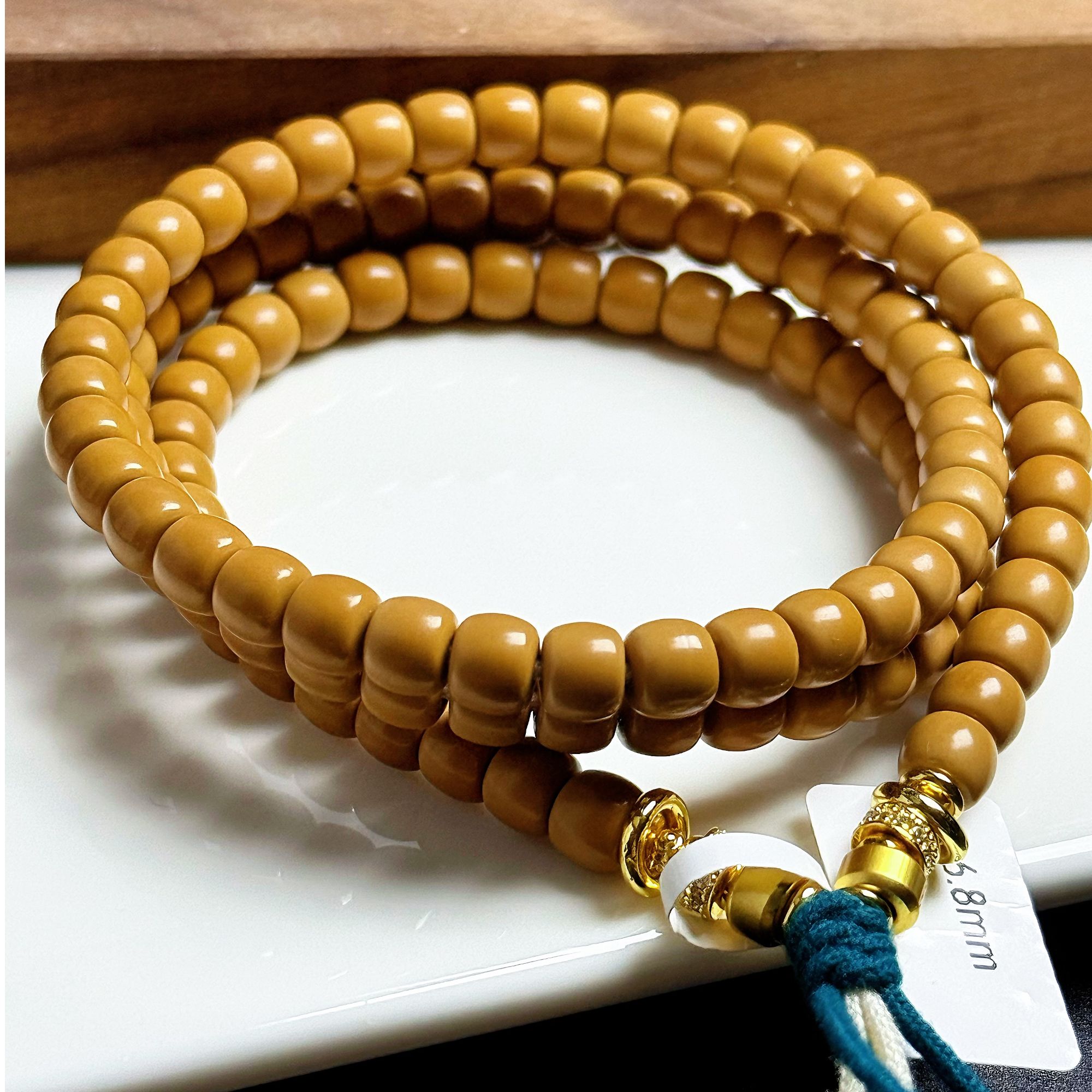 橄榄核老挝极限弧6.8mmS+108长串孔道微瑕老红核上色快【森澜出品】