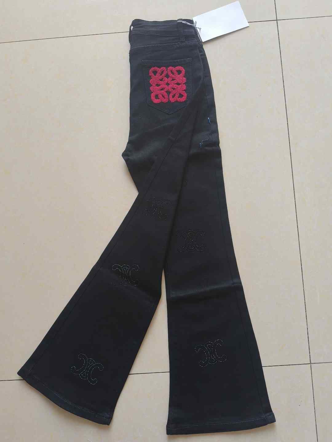 黑色中国结刺绣高腰微喇裤