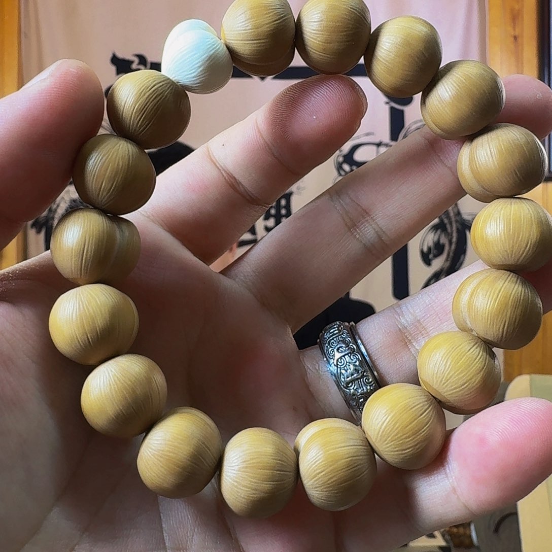是***光猴头核桃手串屁桃带猛犸牙