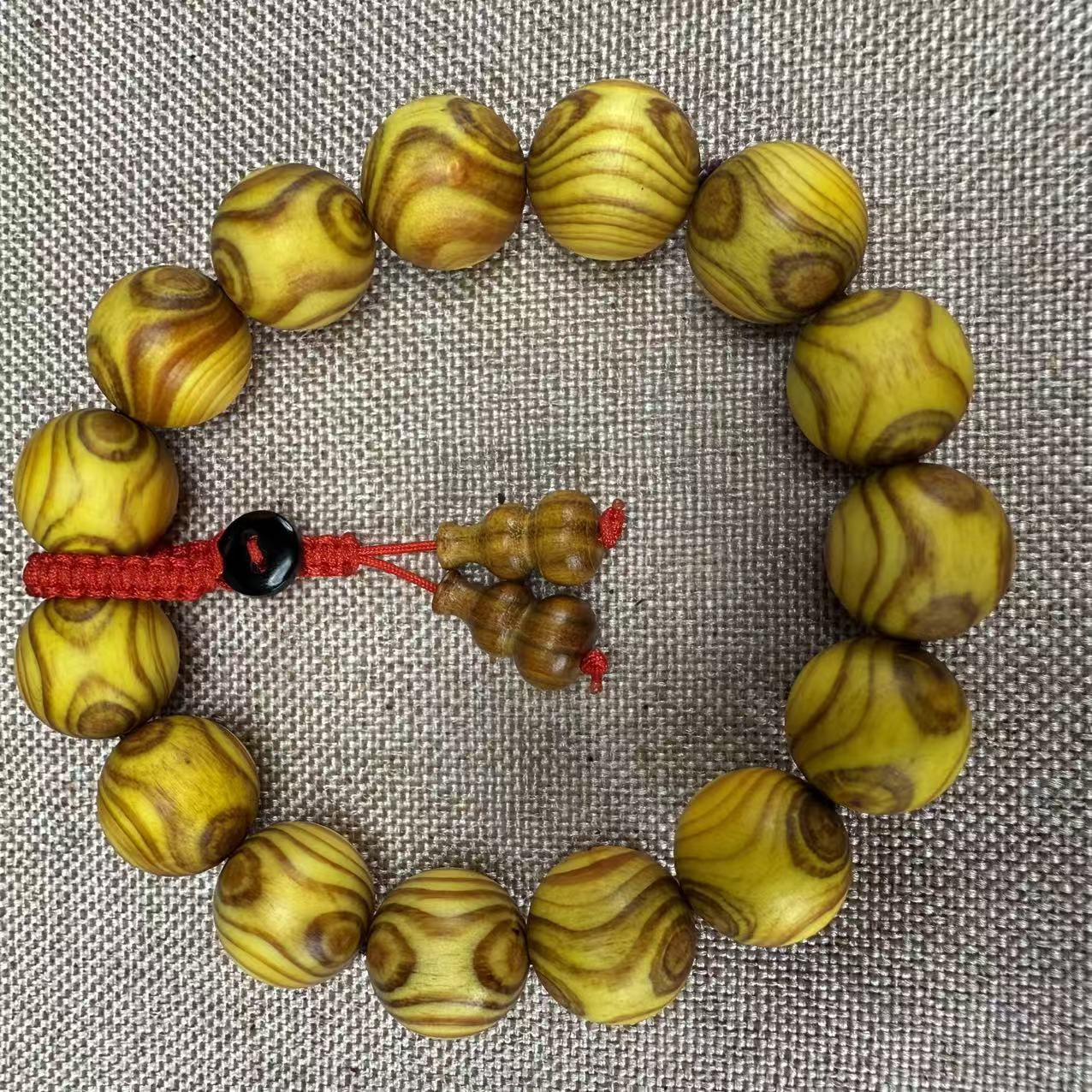 【芸奇】琥珀木对眼1.5单圈文玩手串