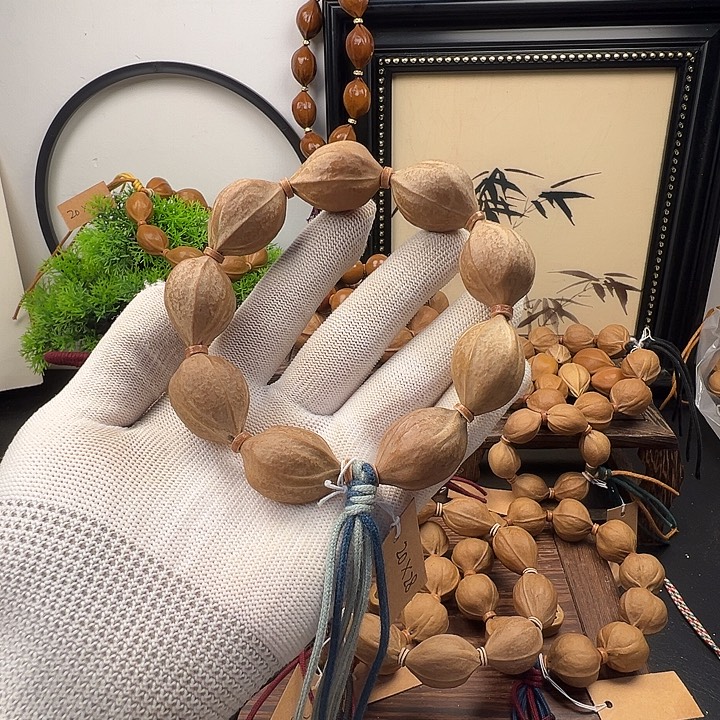 萝***人手串橄榄核20.28梅林铁核