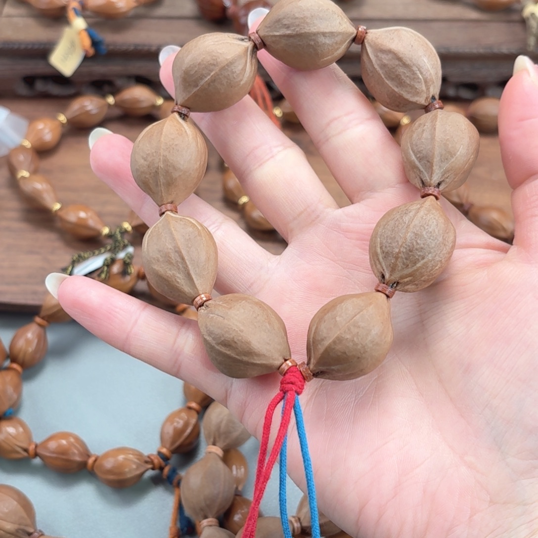 哆***包橄榄核手串三花定制三通