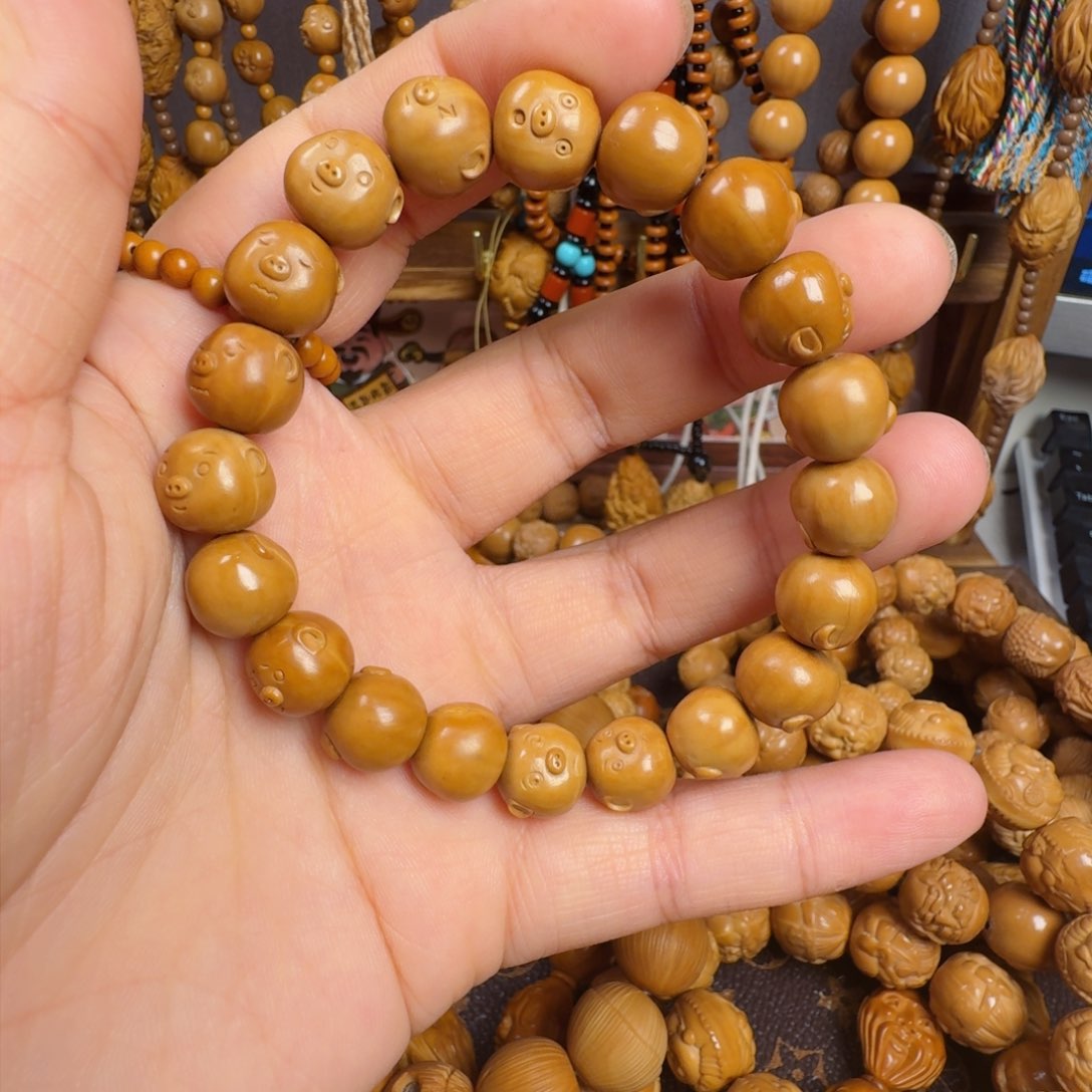 橄榄核手串看***ꐟ百态小猪